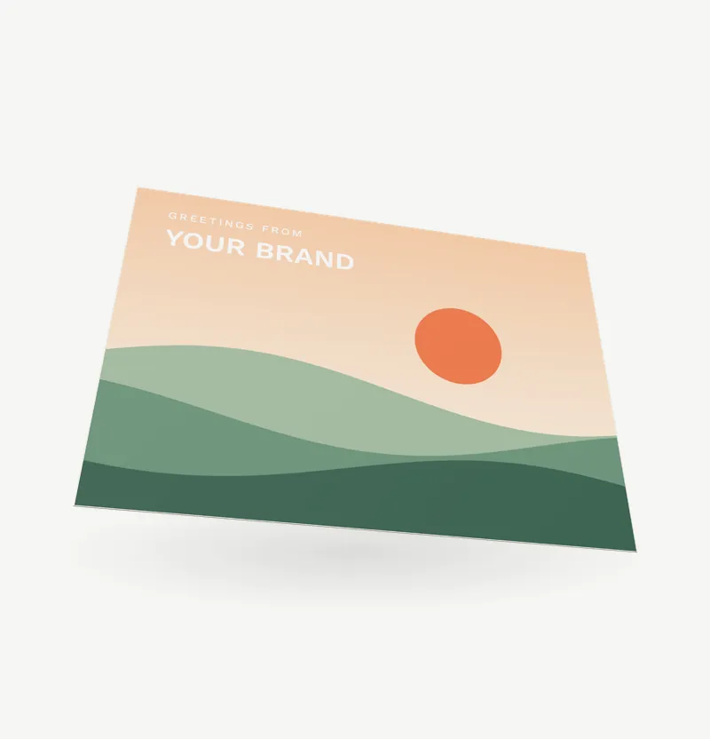 An A6 postcard with a landscape picture and a message side